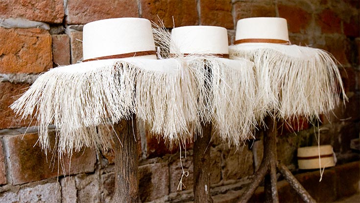 Three Hats on Weaving Stands